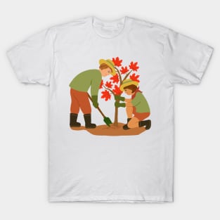 Young couple planting red maple tree. Outdoors gardening concept. T-Shirt